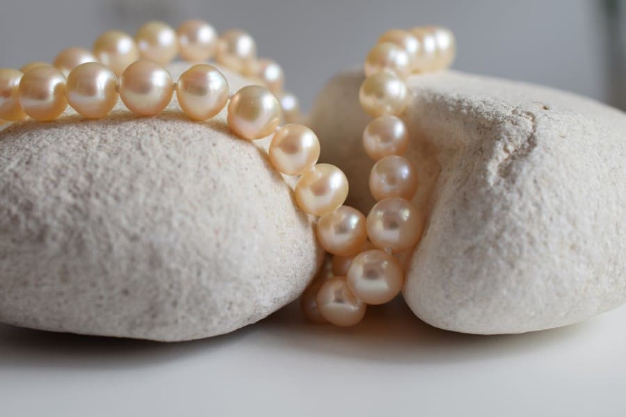 Pearls Necklace on White Rocks