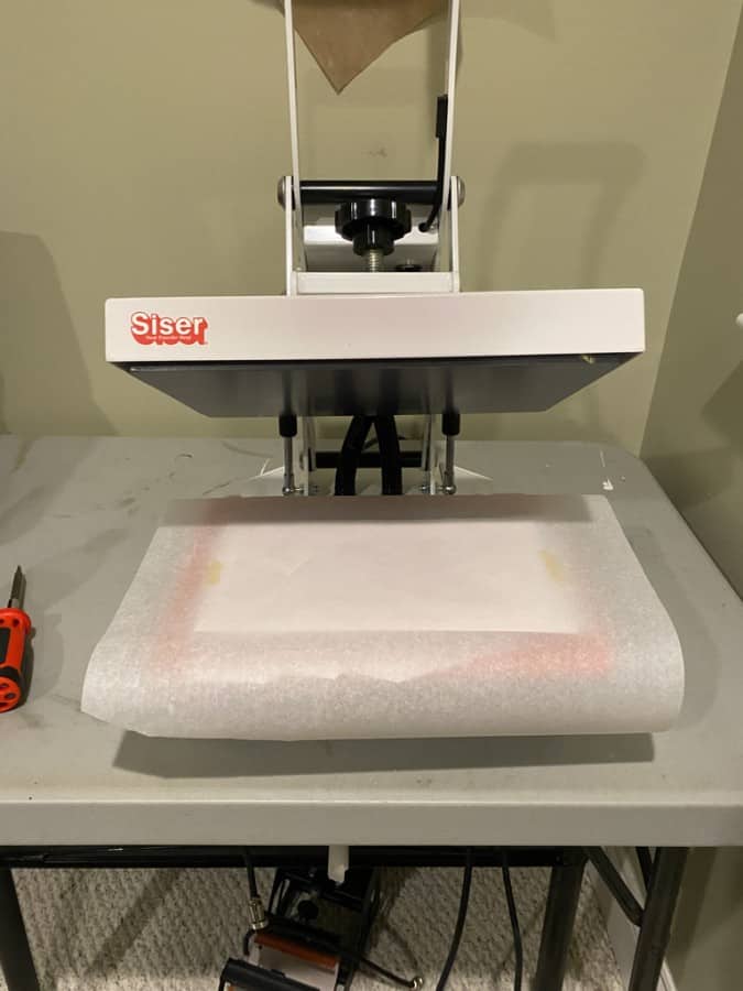 siser heat press with layered butcher paper